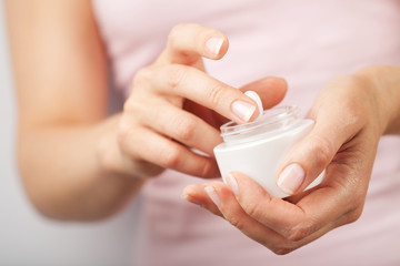 beautiful woman hands with cream