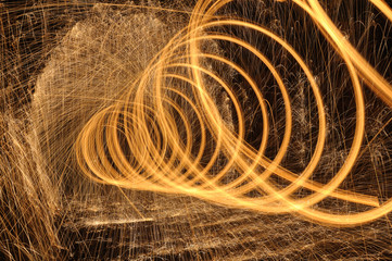 burning steel spiral in a dark tunnel
