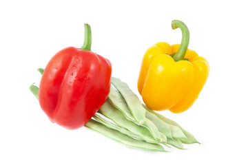 Green beans with yellow and red peppers on a white background