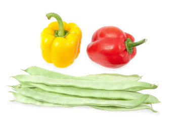 Green beans with yellow and red peppers on a white background
