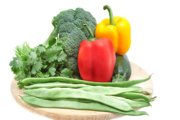 vegetables on a wooden board isolated on white