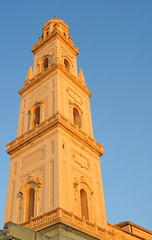 Fototapeta na wymiar Duomo tower against blue sky in Lecce, Italy