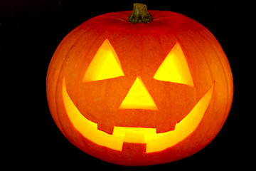 Halloween pumpkin with scary face isolated on black