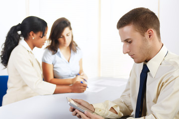 Fototapeta premium Caucasian businessman with a Tablet PC