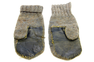 old woolen mittens isolated on white background