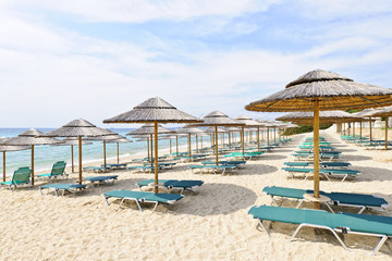 Beach umbrellas on sandy seashore