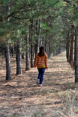 girl walking in the forest