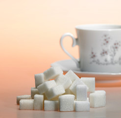 lump sugar pile and coffee cup in warm light