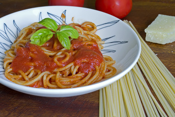 spaghetti with ingredients around