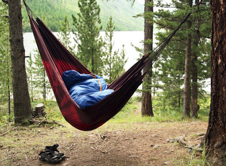 Man sleeps in a hammock and in a sleeping