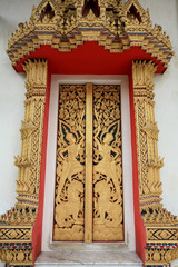 Ornament: Gold art pattern of god and lion on temple door