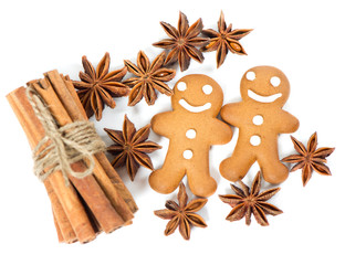 Obraz na płótnie Canvas gingerbread man cookies with anise stars and cinnamon sticks
