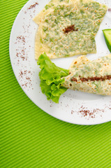 Pancake with herbs in the plate