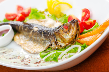 Fried fish in the plate
