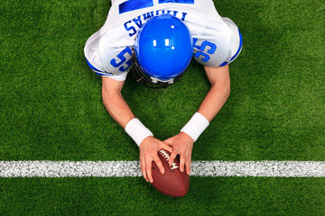 Overhead American football player touchdown - obrazy, fototapety, plakaty