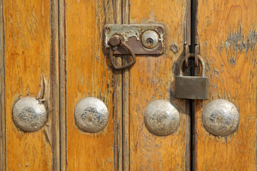 Fototapeta premium lock on the yellow wooden door