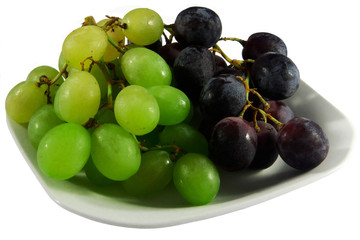 Plate of black and white grapes