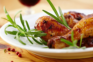 Roasted chicken legs with rosemary sprigs