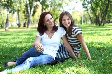 Fototapeta premium Mother with her daughter in summer park