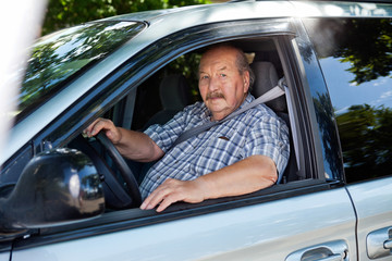 Senior man driving a car