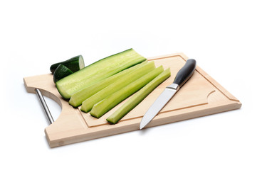 green cucumber on wooden board isolated. sushi ingredients