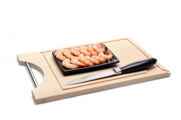 fresh shrimps on wooden board isolated. sushi ingredient