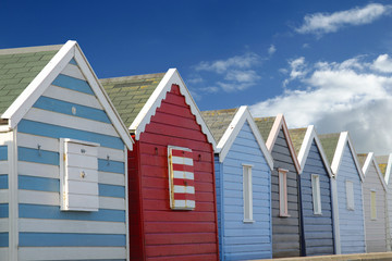 Fototapeta na wymiar Beach huts and blue sky