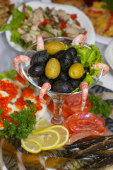 Fish plate appetizer with shrimps and olives