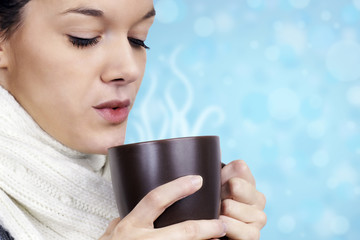 Young woman with hot beverage