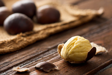 Raw Chestnuts on Wood with Jute