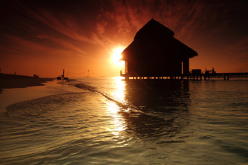 maldivian houses on sunrise
