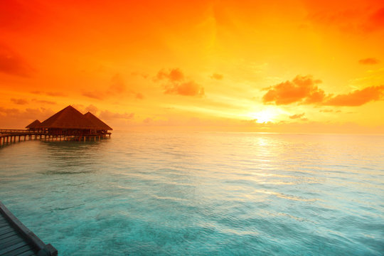 maldivian houses on sunrise
