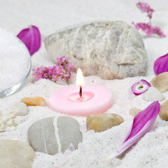 Wellness mit Kerze und Steine in Rosa
