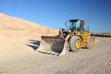 Front view of loader machine at the construction zone
