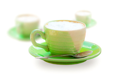 Cup of green coffee on white background