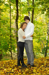Embracing loving couple in the park