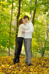 Embracing loving couple in the park