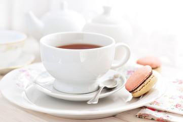Fototapeta na wymiar Cup of tea and French macaroons