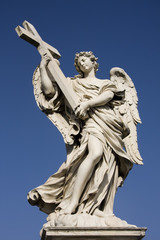 Fototapeta na wymiar Statue of an angel on the Sant Angelo Bridge in Rome