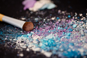 colourful eyeshadow make-up powder and brush with shallow dof