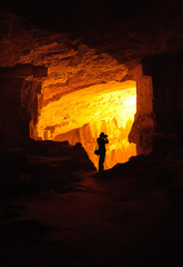 Silhouette of a photographer in Zedekiah's cave in Jerusalem