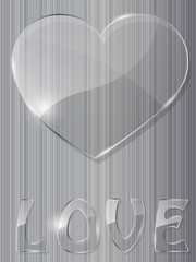 Glass heart on metal background