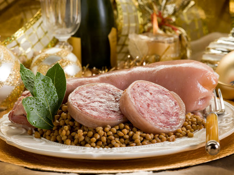 pig trotter with lentils over golden christmas table