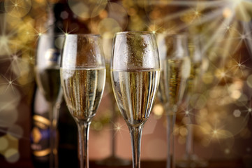 flutes with champagne over blur effect