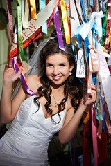 Obraz na płótnie Canvas Happy bride and colorful ribbons
