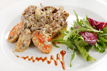 Fricassee with seafood and salad
