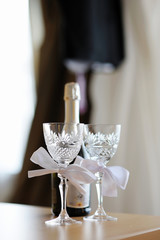 Two empty wedding champagne glasses with a bows