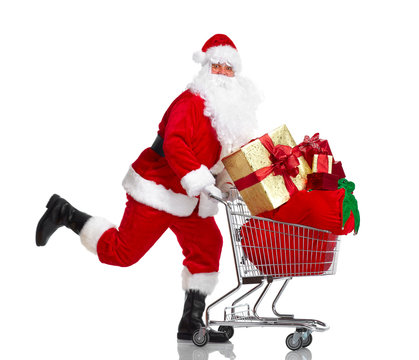 Santa Claus With Gifts And Shopping Trolley.
