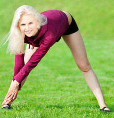 Beautiful woman doing yoga stretching exercise