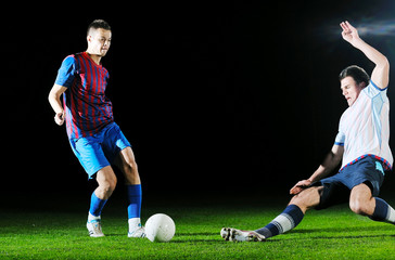 football players in competition for the ball